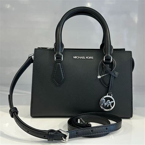 michael kors tasche kunststoff|Michael Kors opened satchel purse.